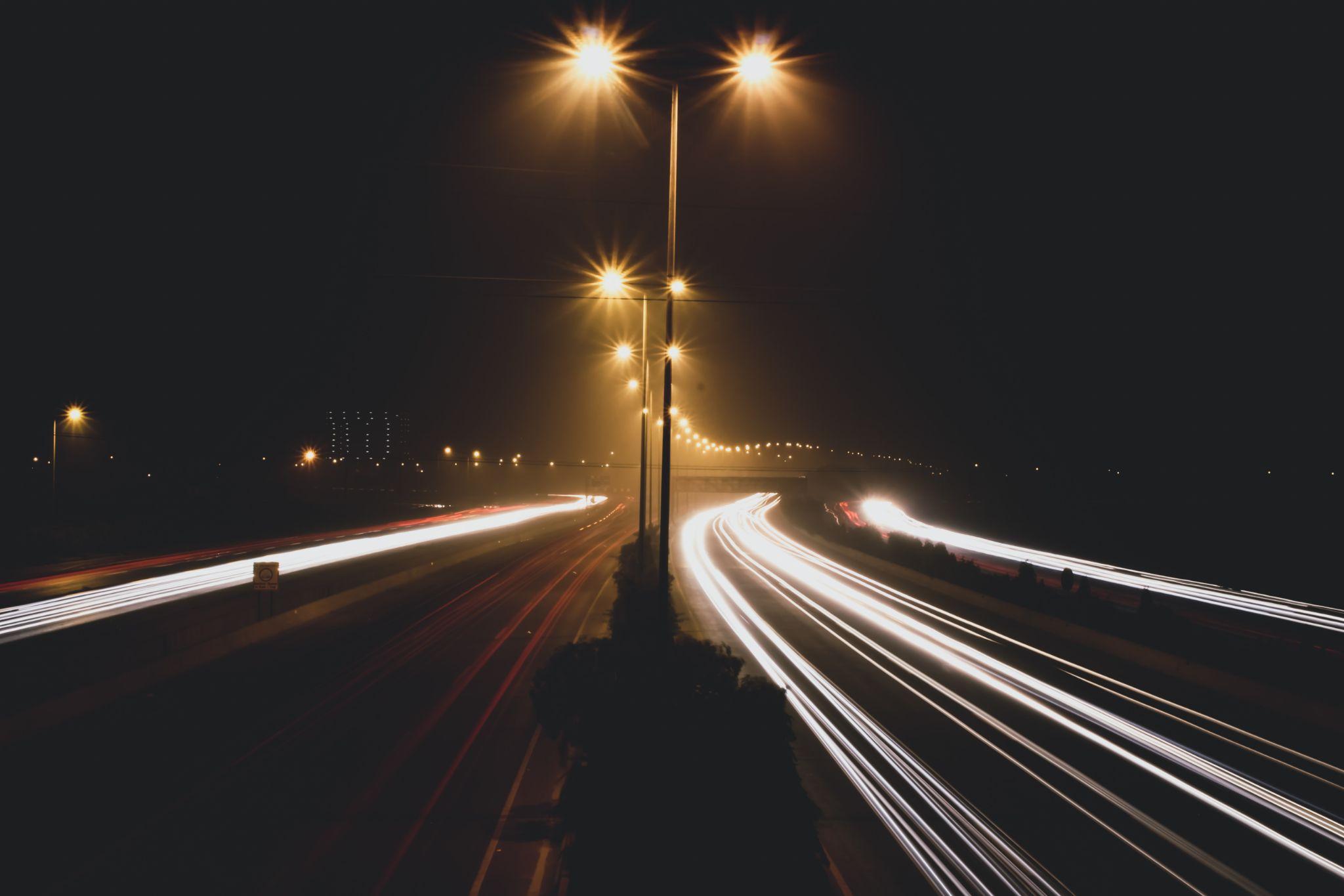 How does smart lighting adapt to the needs of a city?